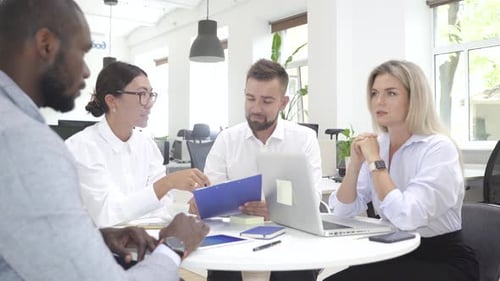 Multiethnic Business People During Meeting in Modern Office