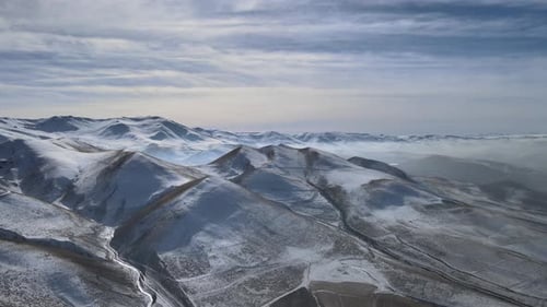 Snowy Mountains and Valleys Aerial Winter Landscape