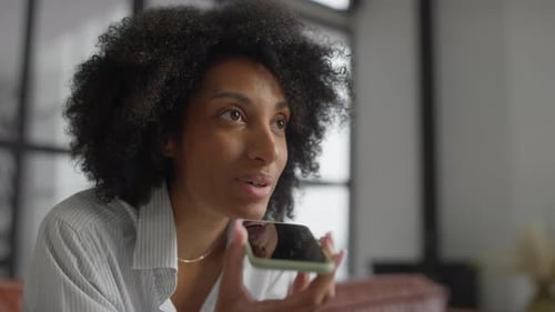 Woman Talking on Smartphone Indoors