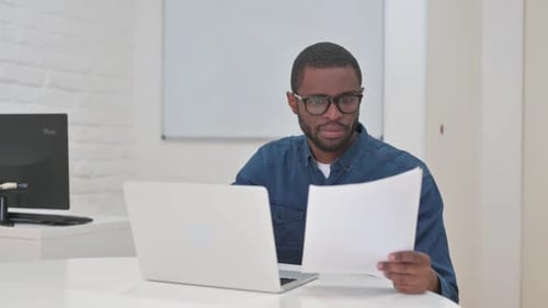 Adult is Upset at Desk at Workplace