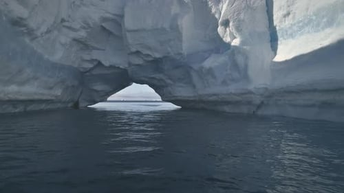 Antarctic Ice Cave Opening to Calm Ocean