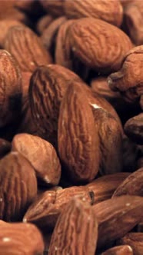 Almonds Fall on the Table Filmed on a Highspeed Camera at 1000 Fps