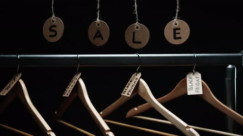 Clothes Hangers with Sale Tags on Rack