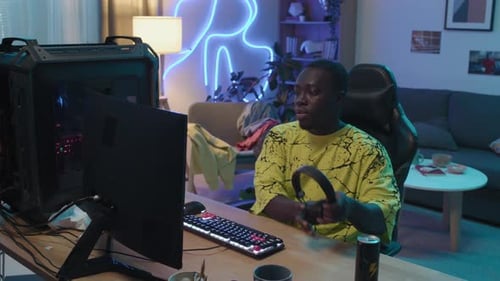 Young Adult Gamer Playing and Winning Video Game