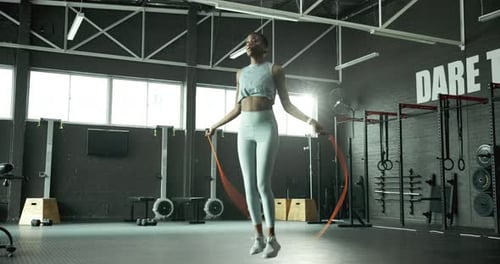 Jump, skipping rope or black woman with fitness for body health, training