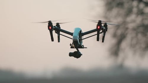 View Drone Copter Flying and Analyzing Farming Fields at Rural Landscape Agribusiness Innovations