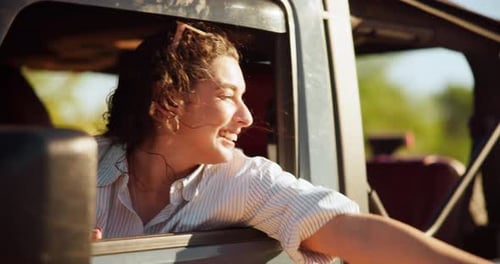 Window, road trip and woman with freedom, car and excited for tourism in vehicle