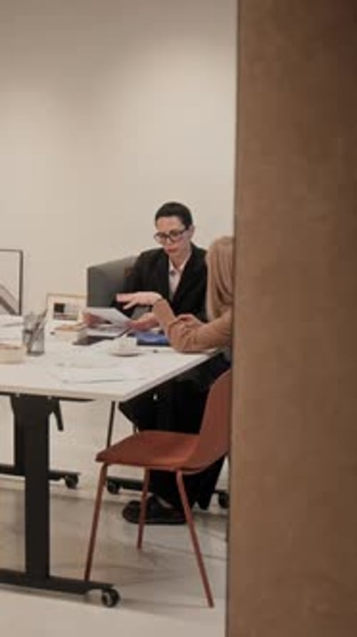 Business Colleagues Meeting at Table in Modern Office