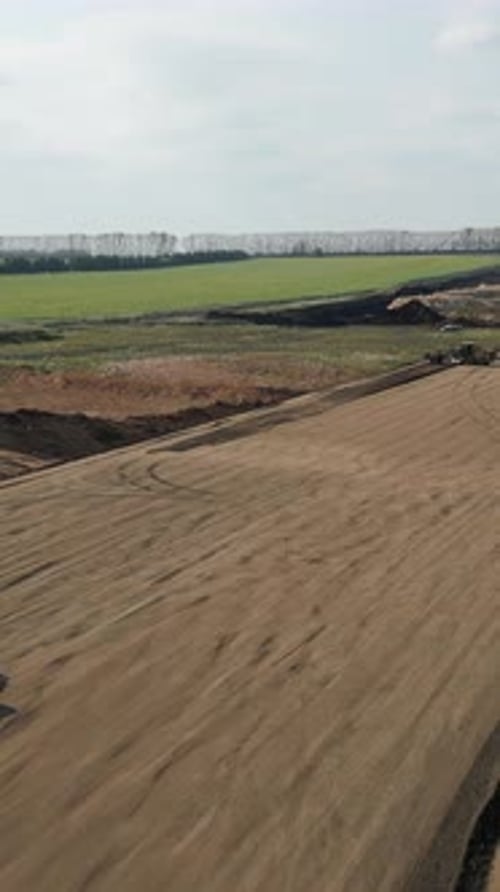 Road Roller Flattening Ground at Construction Site Clip