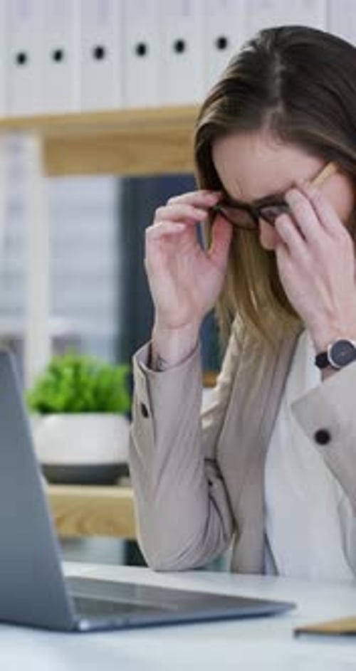 Frustrated, business woman or glasses with headache for stress, anxiety or deadline in office