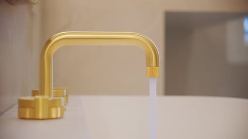 Man Hand Closed the Water Tap to Save Water Turning Off the Faucet in Bathroom