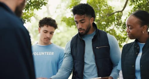 Clipboard, conversation and food drive with volunteer group outdoor charity or community service