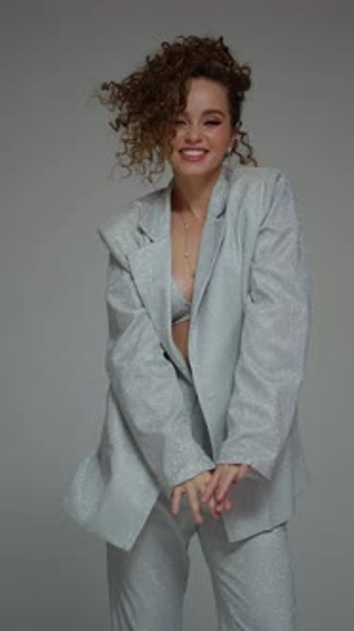 Model Posing Concept A Beautiful Young Woman Poses for a Photographer in the Studio