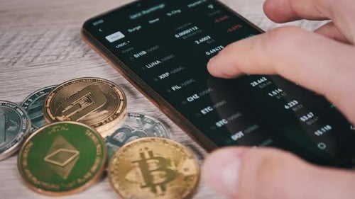 List of Cryptocurrencies on the Smartphone Screen in the Mobile Exchange App
