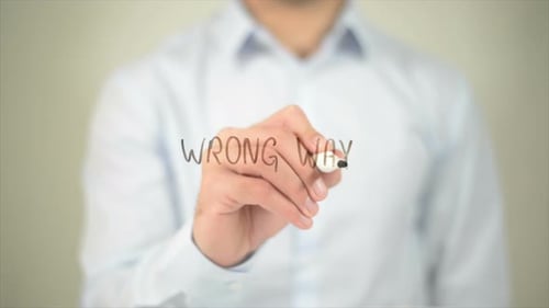 Wrong Way Man Writing on Transparent Screen