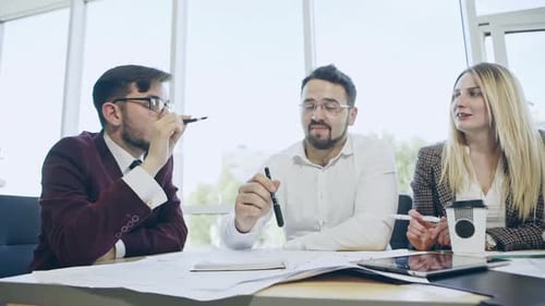Group of Young Business People Working Together in Big Coworking Office
