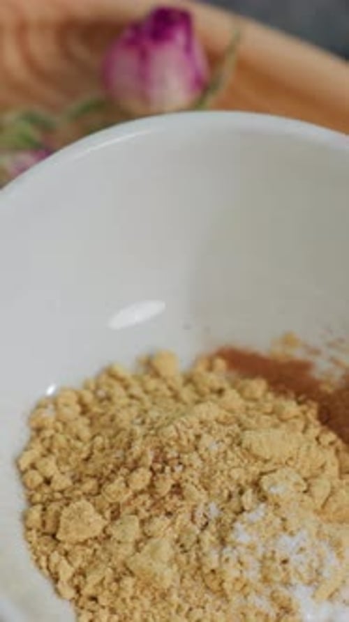 Close Up of Cup of Sugar with Dry Flower and Powder Beverage on Wooden Tray