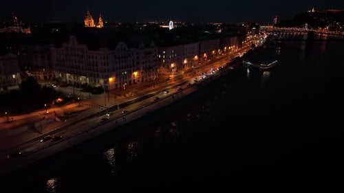 Establishing Aerial View Shot of Budapest City Skyline at night, urban traffic. Hungary