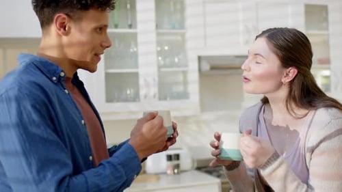 Young Adults Talking in Bright Modern Kitchen