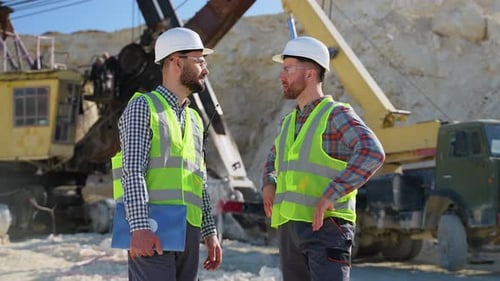Two Men Engineers in Uniform are Talking at the Stone Quarry