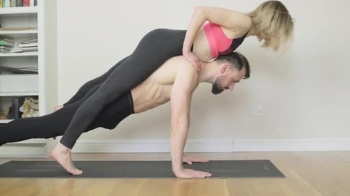 A loving couple find a creative way to exercise together and have fun.