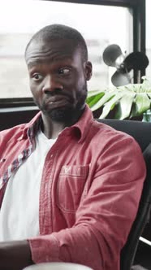 A Dedicated Professional Engaged in Desk Tasks Within a Modern Office Striving for Success