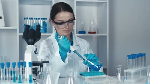 Woman Scientist Working in a Modern Laboratory