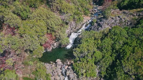 Small Waterfall Cascading Rocks Crystal Clear Pond Drone View Mountains Nature