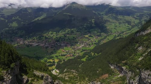 Wide drone shot of descending into Grindelwald, in Switzerland’s Bernese Alps
