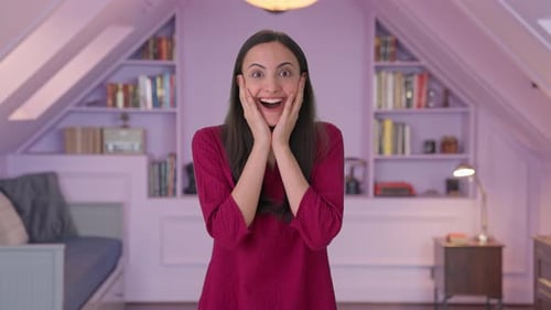 Happy Indian girl getting a big surprise