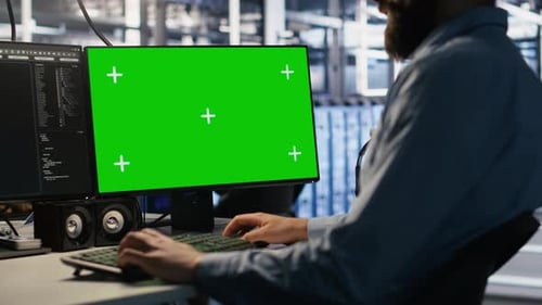 Close Up of Data Center Technician Using Green Screen PC