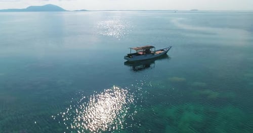 Beautiful 4K UHD aerial drone shot of a tropical Pacific paradise coral reef around islands in Indon
