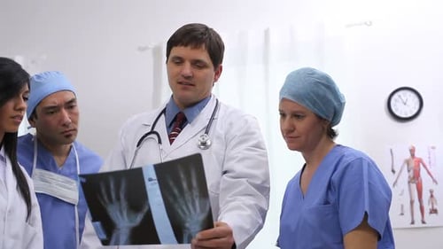 Medical Team Analyzing X-Ray in Hospital