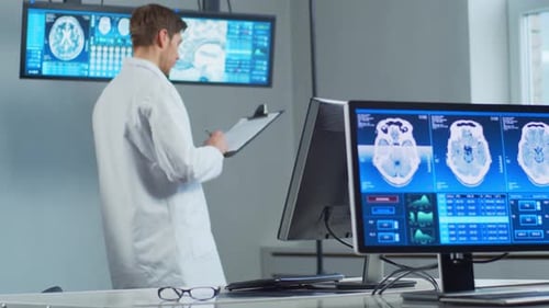 Professional Medical Doctor Working in Hospital Office Using Computer Technology Medicine