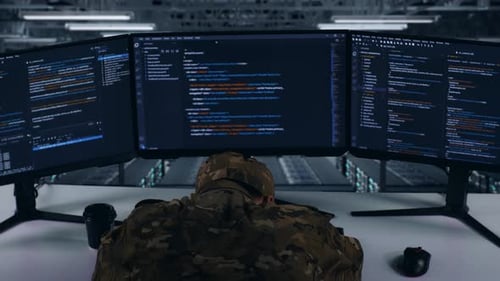 Back View Of Tired Asian Military Sleeping While Write Code In Data Center