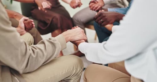 People, holding hands and together in group therapy with circle, praying