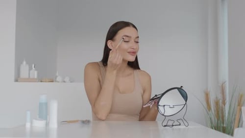 Woman Applying Makeup in a Bright Modern Bathroom Environment With Natural Light