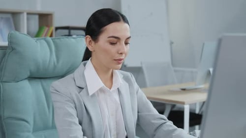 Professional Woman Smiling in Bright Office