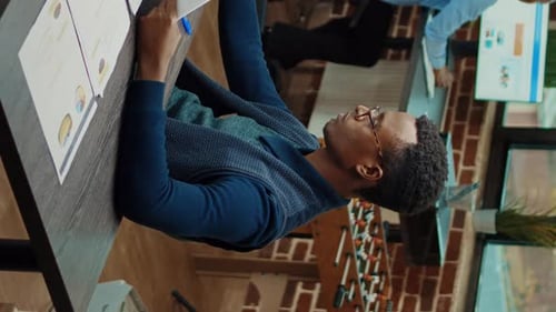 Adults Working in Bright Modern Urban Office