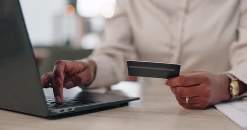 Hands, woman and laptop with debit card in office as banker or financial advisor for banking