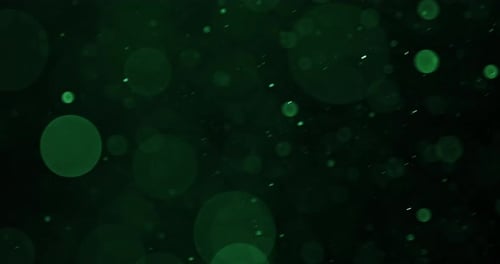 Vibrant Green Bokeh Circles Streaming Diagonally