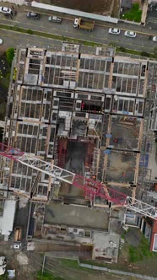 Vertical Video of MultiStory Building Walls Being Installed
