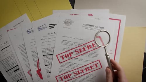 Examining Top Secret Documents with Magnifying Glass