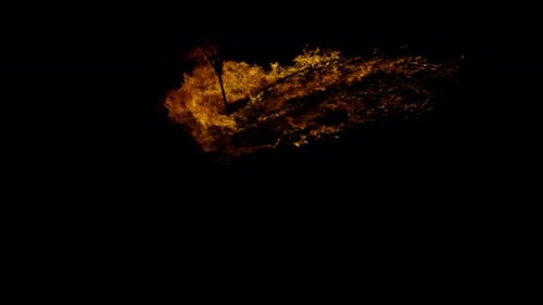 Ignite Collection: Flames ravage a swirling fabric on a dark background shot in 4k at 60fps