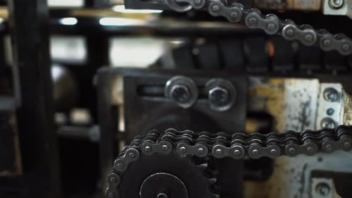 Sprocket Tension Closeup Inspecting Chain Tension and Sprocket Wear