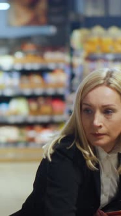 Blonde Woman Browsing in a Store