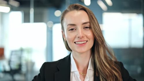 Professional Businesswoman Smiling Confidently in Office