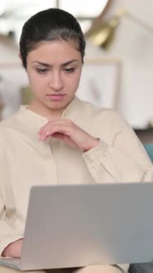 Woman Using Laptop Massaging Her Stiff Neck