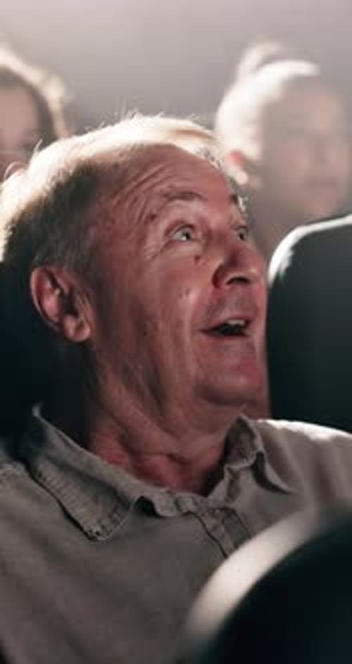 Senior, happy man and surprise with movie at cinema for suspense, shock or entertainment