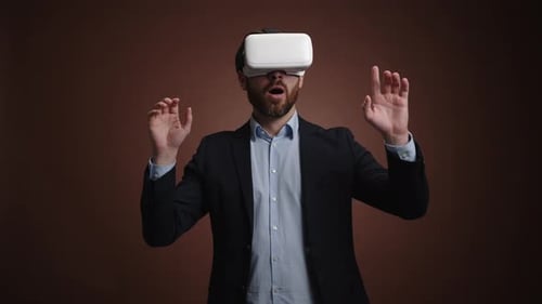 Man Wearing VR Headset Interacting with Virtual World